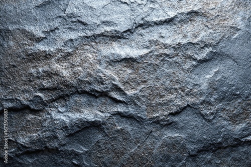 Close-up of a rough, textured, gray stone surface