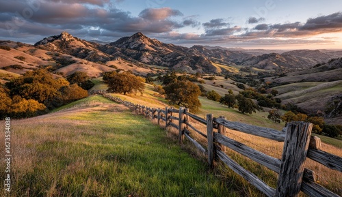 Golden hills, rugged peaks, tranquil scene