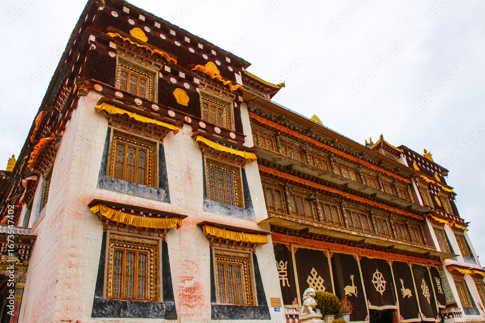 Fototapeta premium Intricate, vibrant Tibetan monastery architecture Sangpi Monastery, Xiangcheng, Sichuan