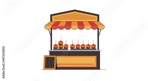 A candy apple stand with striped awning  apples displayed A blank chalkboard stands beside it