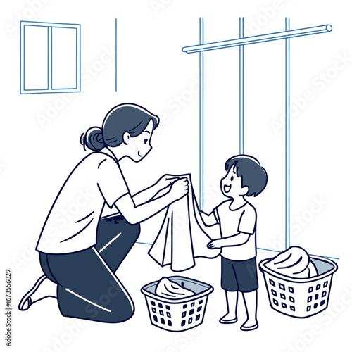 A mother and her young son happily folding laundry together indoors, teaching and learning household chores.