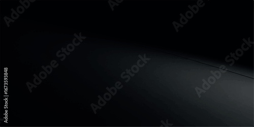 A soft gradient of light fades across a dark, smooth surface, creating a subtle visual effect with a clean, minimalist aesthetic