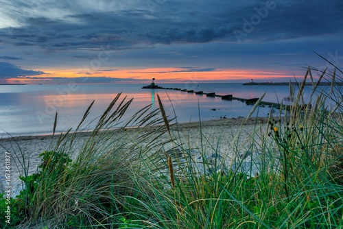 Fototapeta Naklejka Na Ścianę i Meble -  Sunset over the Baltic Sea beach in Gorki Zachodnie, Gdansk. Poland