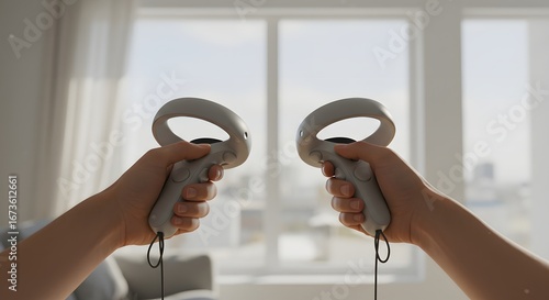 Two hands hold white VR controllers against a bright window, suggesting immersive virtual reality gaming or experience.