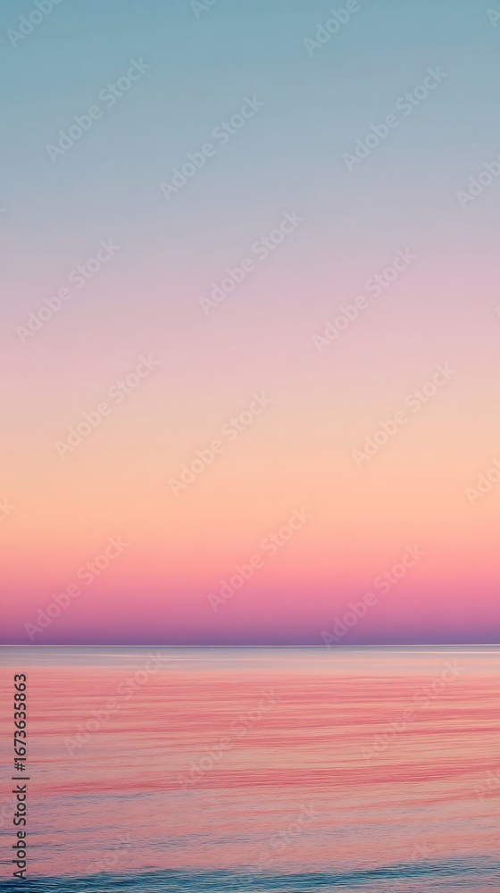 Fototapeta premium Pastel sunset over the ocean creating a serene and peaceful atmosphere