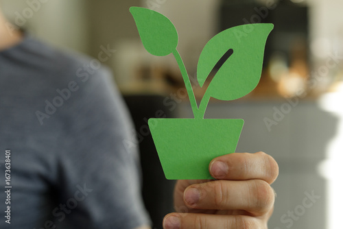 Image of a hand holding a p...