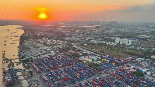 Aerial sunset view of Cat Lai port with cargo ship and container. Large import and export port important for economic development in Ho Chi Minh City, Vietnam