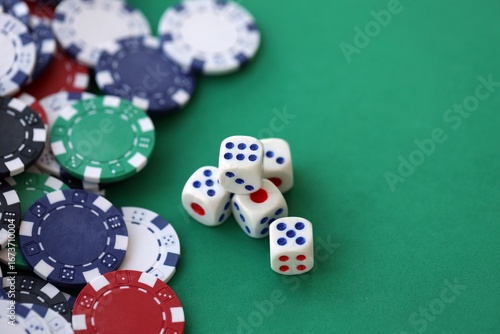 Dice game on the poker table in the casino. A successful combination of dice brought a lot of winning chips