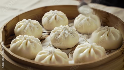 Wallpaper Mural Eight White Steamed Buns in Bamboo Steamer with Powdered Sugar Dusted on Top a Culinary Still Life Perfect for Food Advertisements and Celebrating National Dumpling Day a Close Up Shot Torontodigital.ca
