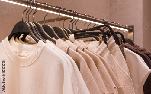 Clothes rack showcasing a variety of stylish garments in a modern retail environment