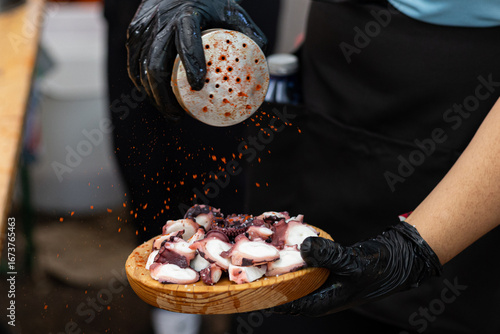 Octopus Fair in Galicia. Octopus cooked with oil, paprika, and salt. Close-up of octopus.