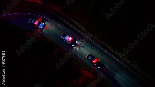 Night police cars with blue red lights chase on road shows law enforcement crime safety speed emergency create tension urban control justice authority public order pursuit excitement pursuit dramatic