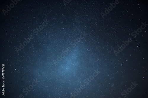 A blue, watercolor-style space background. Illustration © dadakko