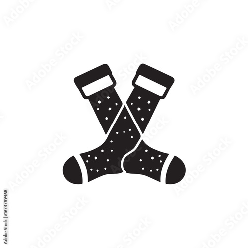 Vector art of pair of black socks with white polka dots and striped cuffs