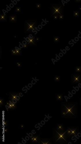 キラキラ光る金色の光のエフェクト背景動画。縦長	