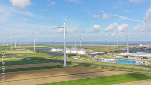 Aerial drone of Eemshaven port oil silos with solar panels, energy transition