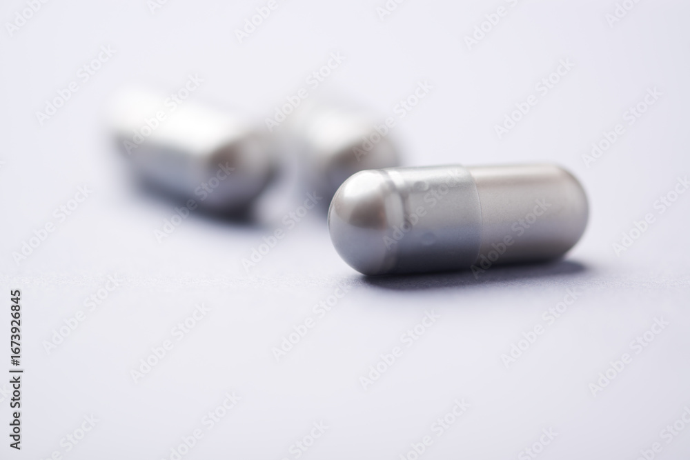 Naklejka premium BCAA amino acids tablets. Nutrition for bodybuilding. Fitness supplements on bright background. Soft focus. Copy space. 