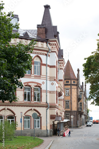City street view of old historical buildings with architectural details. European urban landscape. Travel landmark exterior.