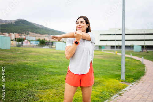 Obraz na plátne A woman between 40 and 50 years old is exercising outdoors