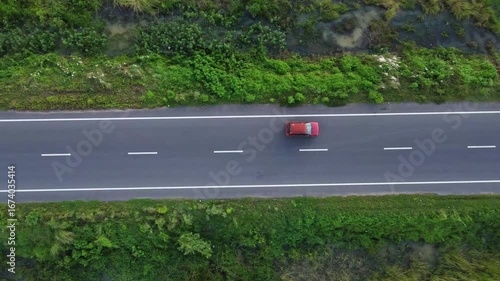Aerial Top View of Busy Indian Road with Moving Vehicles. Top View of Indian Village Road with Cars and Motorbikes. Beautiful Road of a Village in India.