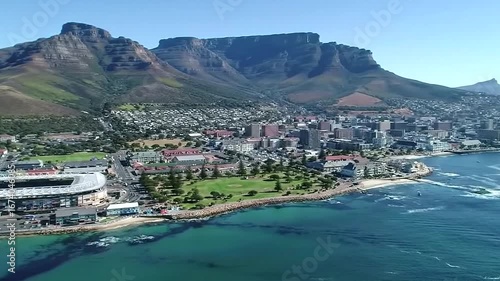 Panoramic aerial view of cape town, south africa, with table mountain dominating the skyline and the vast atlantic ocean stretching to the horizon