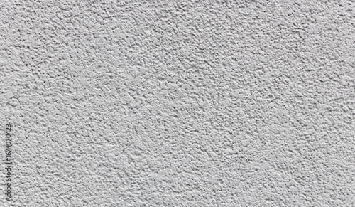 Textured abstract texture of a light gray concrete wall.