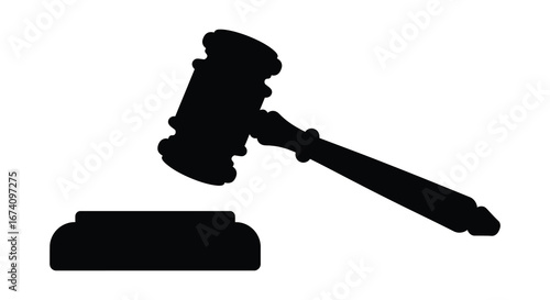 Black silhouette of a gavel and sound block on white background