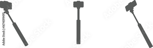 Three selfie sticks in silhouette from different angles