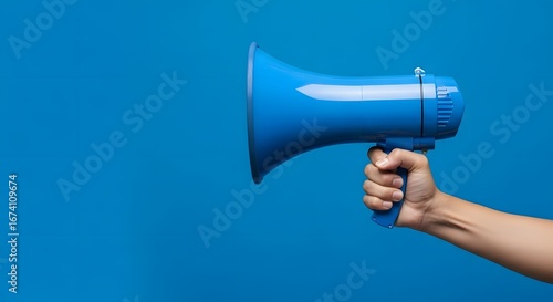 Bold blue megaphone held by hand announces message against vibrant solid background