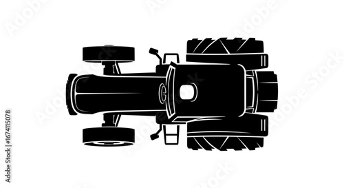Top-down view of a black tractor with large tires, showcasing its shape and design.