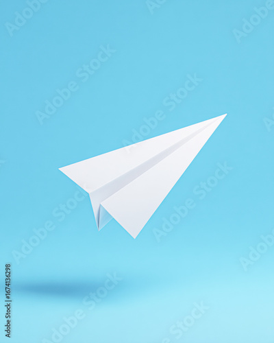 Wallpaper Mural A minimalist paper airplane floats against a light blue background, symbolizing creativity and freedom. Torontodigital.ca