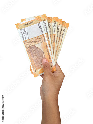 Hand holding multiple 200 rupee  notes of Indian banknotes, cash in organised manner, fan like spread. Giving money, paying, cashflow 
