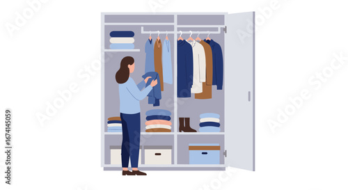 Woman organizing closet with folded clothes and hanging garments in modern minimalist style