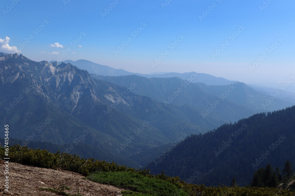 Fototapeta premium A mountain range against a clear blue sky