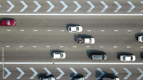 Aerial Drone Clip Looking Down On The Commuter Traffic jam. Aerial video of traffic jam in rush hour. vehicle traffic on motorway. Moderate car traffic.