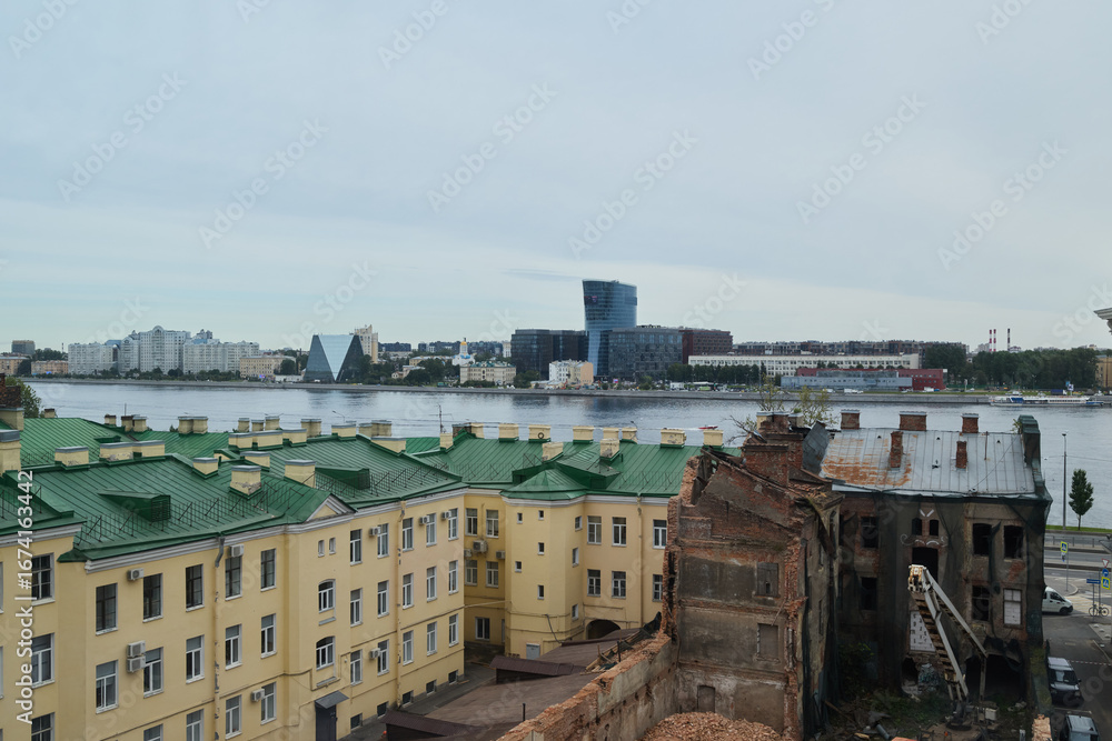 Fototapeta premium An Urban Landscape Showcasing a Picturesque Riverfront Alongside Historical Architecture