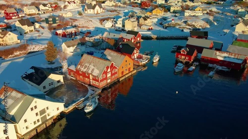 aerial footage captures the picturesque winter landscape of a traditional fishing village in the Lofoten Islands, Norway.