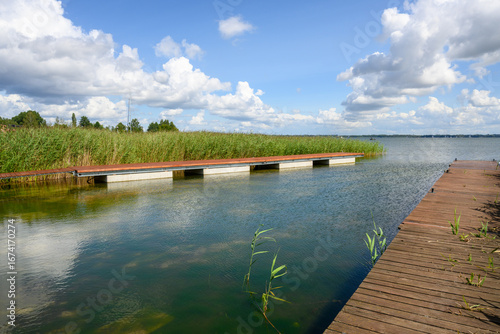 Fototapeta Naklejka Na Ścianę i Meble -  Wooden pier on lake Niegocin shore. Masurian Lakes. Poland