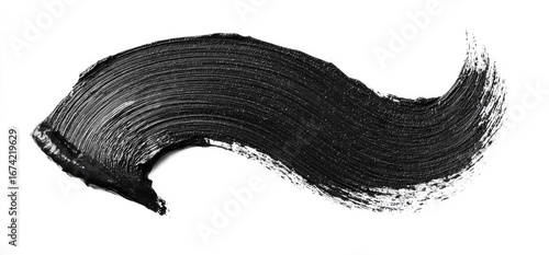 Swath of black creamy substance, like paint, on white backdrop