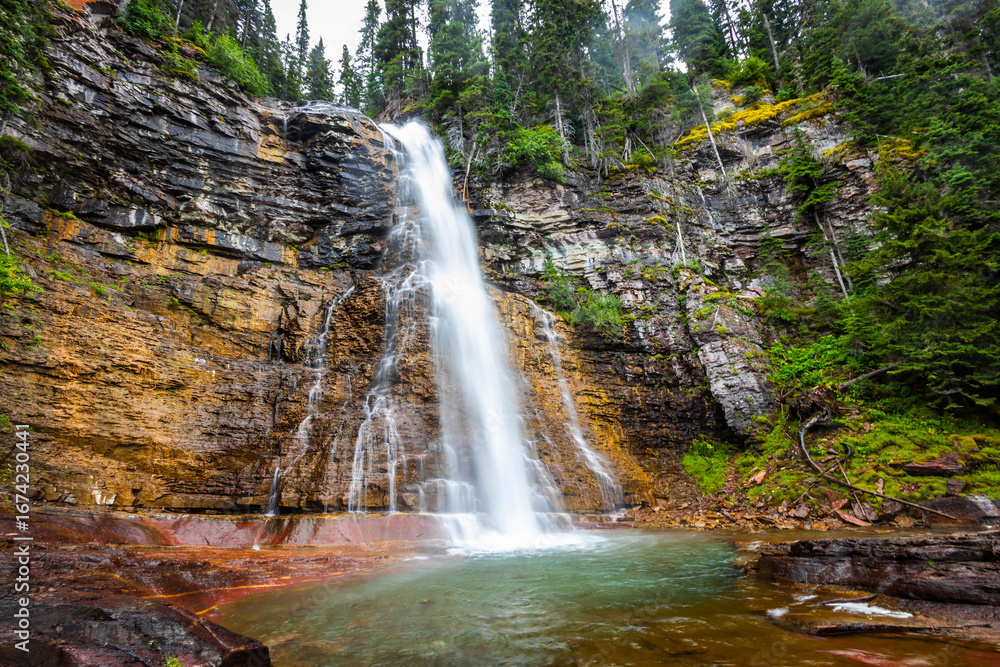 Obraz premium Scenic Virginia waterfall close up in Glacier National Park on summer day