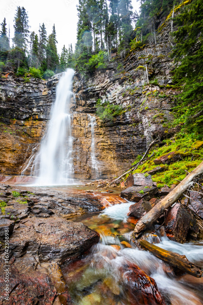 Obraz premium Scenic Virginia waterfall close up in Glacier National Park on summer day