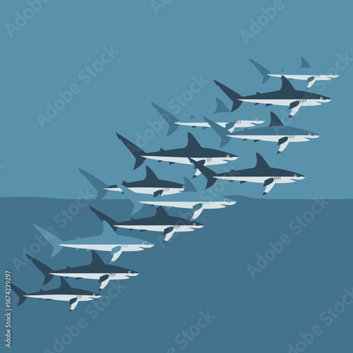 A school of sharks swimming in blue ocean water.