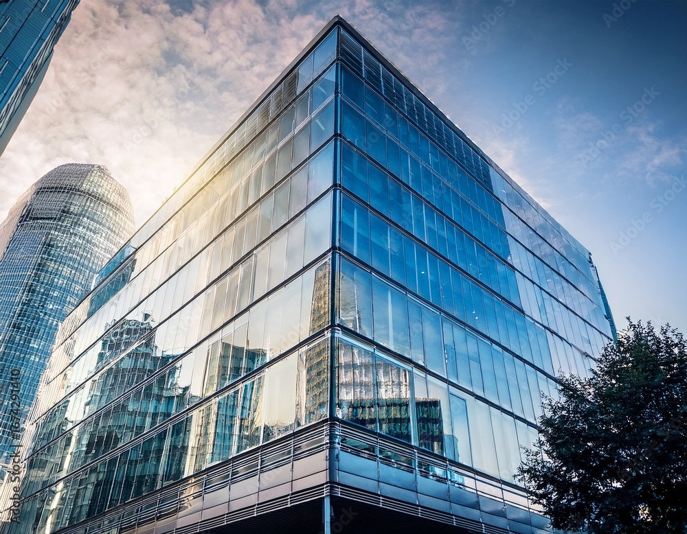 Fototapeta premium modern london office block sleek glass facade reflecting city skyline architectural detail urban landscape workplace property