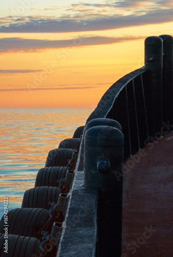 Sliced view of a tug boat plying through surreal waters at twilight