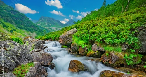 Timelapse landscape of a moving mountain river and clouds. High quality 4k footage