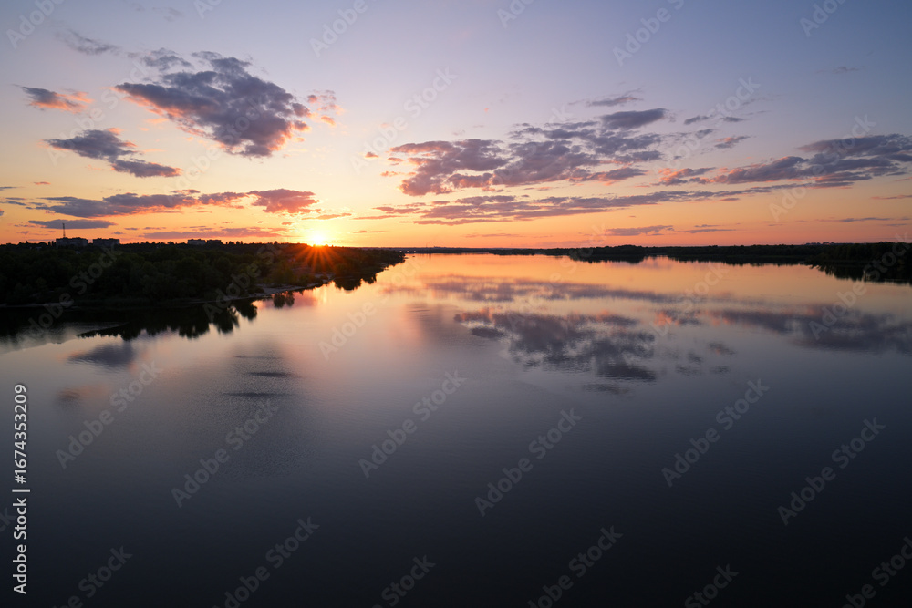 Fototapeta premium Sunset over Dnipro River in Kamianske, Ukraine