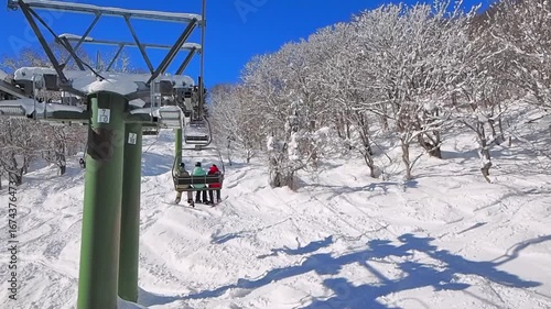 Riding a chairift through rime-covered trees (Madarao, Nagano, Japan)