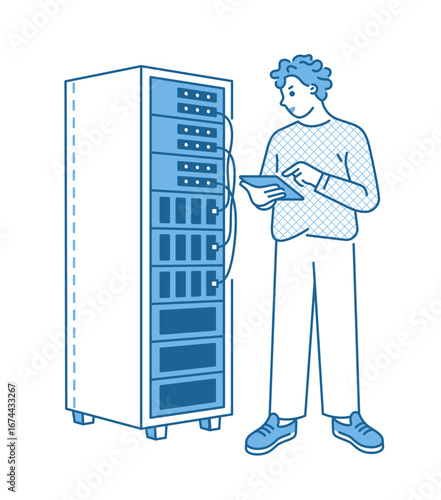 System administrator next to server rack 