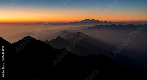 Wallpaper Mural Stunning mountain range panorama at sunset with ethereal orange glow and clear blue sky Torontodigital.ca