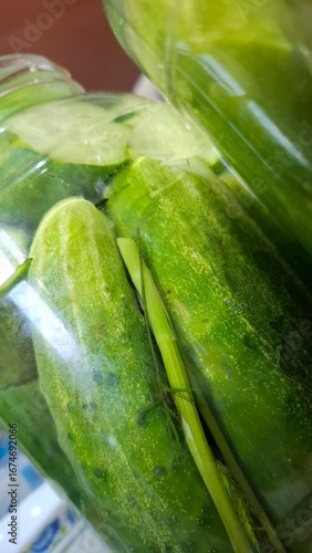  green cucumbers, pickled in glass jars, healthy food, delicious food